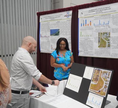 A sustainability student presents her research project at the student design showcase